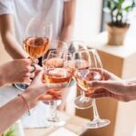 Women drinking wine at home.