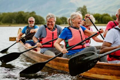 A senior group of friends enjoying rowing on the River Derwent