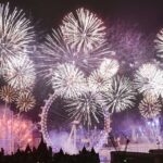 Midnight is celebrated along the River Thames in London with a spectacular and colourful firework display.