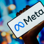 In this photo illustration, the Meta Platforms logo is displayed on a smartphone screen