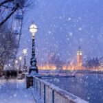 Snowing on Jubilee Gardens in London at dusk