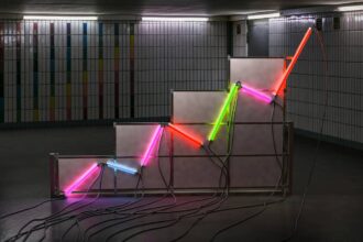 A graph made of neon tubes in a room