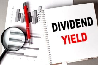 DIVIDEND YIELD text written on a notebook with chart